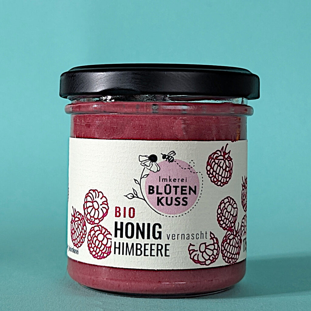 Honig vernascht Himbeere